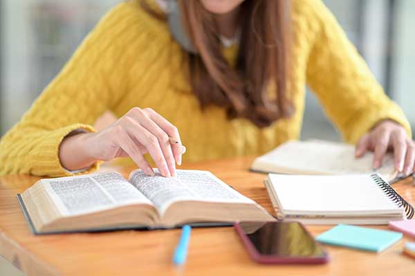 Students are reading books to prepare for university entrance ex